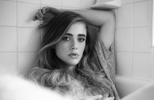 Black and white photo of Melissa Roxburgh in a grey t-shirt.